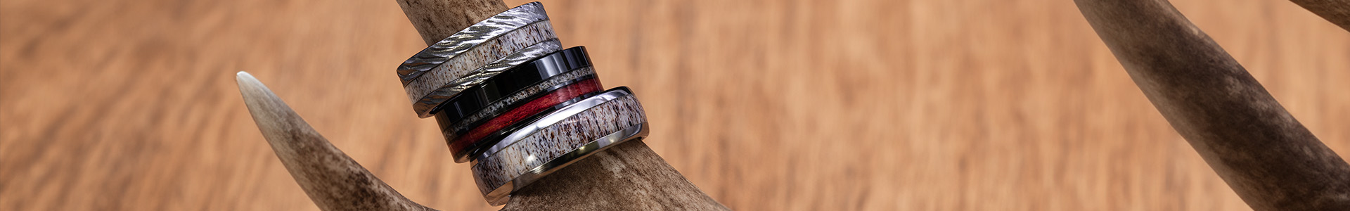 Deer inlay custom handcrafted wedding rings by Jewelry Innovations