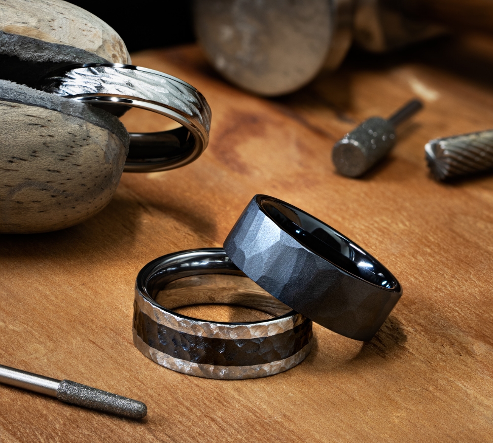 Photo of men's rings on a craftsman's desk.