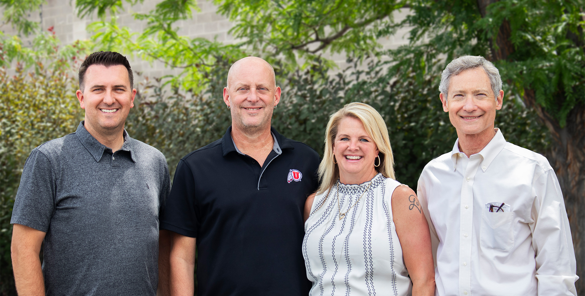 the four jewelry innovations owners standing in front of trees